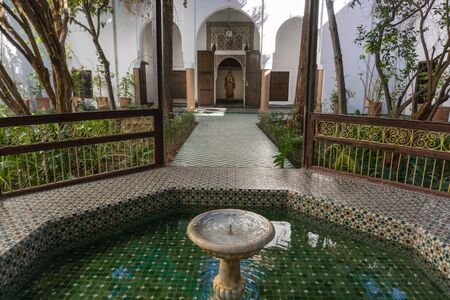 MARRAKESH, MOROCCO - JAN 20: Moroccan architecture traditional arabian design - Rich Riyad Dar Si Said mosaic interior. Beautiful Courtyard with fountainのeditorial素材