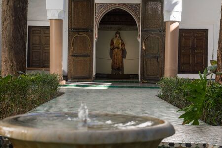 MARRAKESH, MOROCCO - JAN 20: Moroccan architecture traditional arabian design - Rich Riyad Dar Si Said mosaic interior. Beautiful Courtyard with fountainのeditorial素材