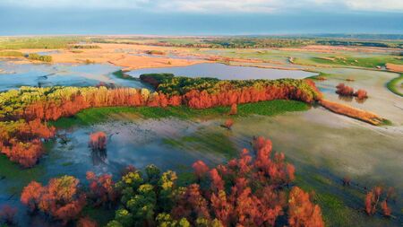 Sunset River Aerial Landscape Cinematic Drone Footage. Flying above Dniestr river in Ukraine or Moldova with forests and fields aroundの写真素材