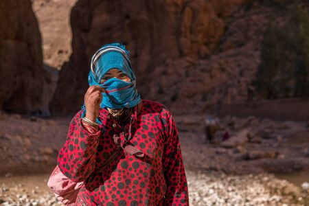 ATLAS MOUNTAINS, MOROCCO - 20 JAN: Nomad tribe people living in mountains near Tinghir or Tinerhir. Woman in canyon near the river. Todra gorgeのeditorial素材