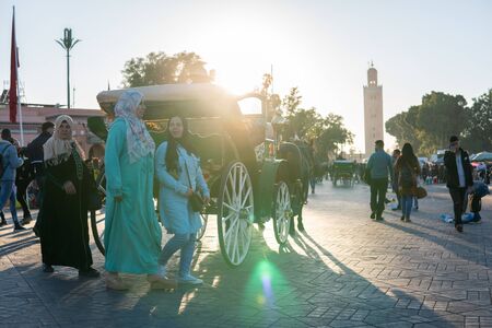 Marrakesh, Morocco - January 2019 : horse-drawn carriage cab waiting for passengers for tour in Jemaa el Fna squareのeditorial素材