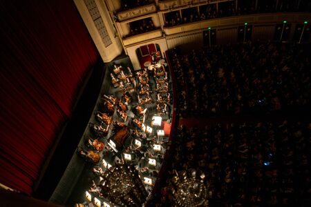 VIENNA, AUSTRIA - OCTOBER 2019: Interior of Vienna State Opera House Performance hall with visitors. Wiener Staatsoper stairs, ballet dancers and orchestraのeditorial素材