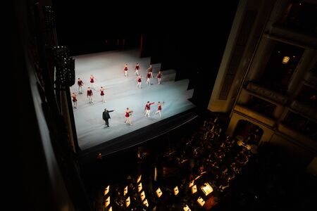 VIENNA, AUSTRIA - OCTOBER 2019: Interior of Vienna State Opera House Performance hall with visitors. Wiener Staatsoper stairs, ballet dancers and orchestraのeditorial素材