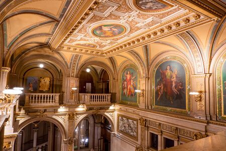 VIENNA, AUSTRIA - OCTOBER 2019: Interior of Vienna State Opera House. Wiener Staatsoper stairs, fresco and rich gold interiorのeditorial素材