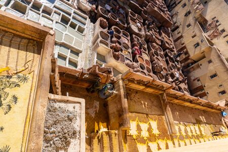 MOROCCO, FEX - January 2019: Man working in Chouara tannery in old medina in Fes, a traditional and old tannery with workers working making methods of leatherのeditorial素材