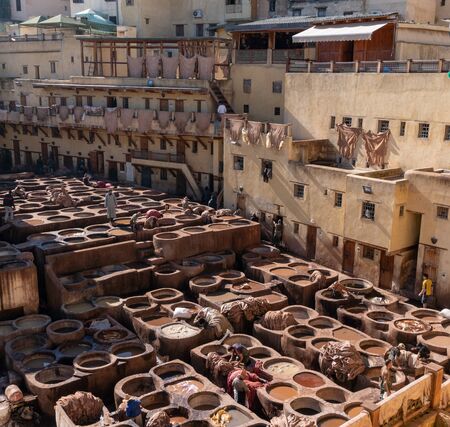 MOROCCO, FEX - January 2019: Workers in Chouara tannery in old medina in Fes, a traditional and old tannery with workers working making methods of leatherのeditorial素材