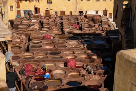 MOROCCO, FEX - January 2019: Workers in Chouara tannery in old medina in Fes, a traditional and old tannery with workers working making methods of leatherのeditorial素材