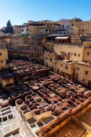 MOROCCO, FEX - January 2019: Workers in Chouara tannery in old medina in Fes, a traditional and old tannery with workers working making methods of leatherのeditorial素材