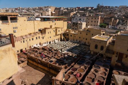 MOROCCO, FEX - January 2019: Workers in Chouara tannery in old medina in Fes, a traditional and old tannery with workers working making methods of leatherのeditorial素材