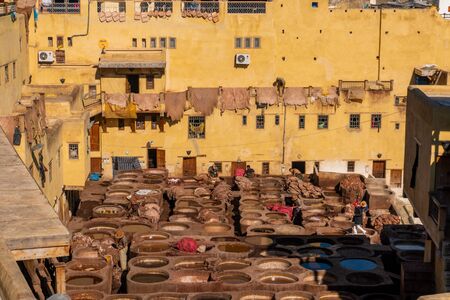MOROCCO, FEX - January 2019: Workers in Chouara tannery in old medina in Fes, a traditional and old tannery with workers working making methods of leatherのeditorial素材