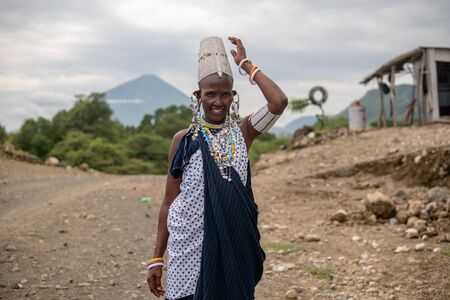 TANZANIA, MASAI VILLAGE - JANUARY 2020: Portrait of Maasai woman people in native masai village Engare Sero on the coast of Natron Lake in Maasailand, Arusha districtのeditorial素材