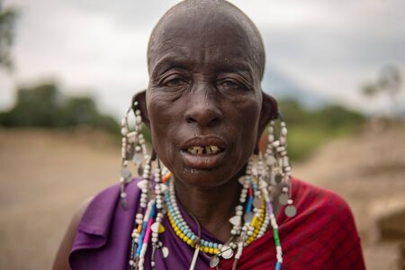 TANZANIA, MASAI VILLAGE - JANUARY 2020: Portrait of Maasai woman people in native masai village Engare Sero on the coast of Natron Lake in Maasailand, Arusha districtのeditorial素材