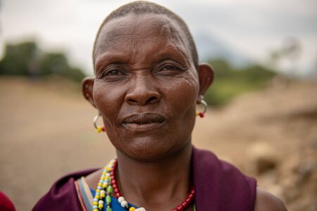 TANZANIA, MASAI VILLAGE - JANUARY 2020: Portrait of Maasai woman people in native masai village Engare Sero on the coast of Natron Lake in Maasailand, Arusha districtのeditorial素材