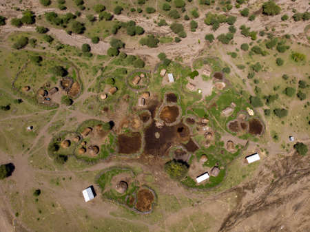 Aerial view of Maasai boma or family rural village on the coast of Salty lake Natron in the Great Rift Valley, Tanzaniaの写真素材