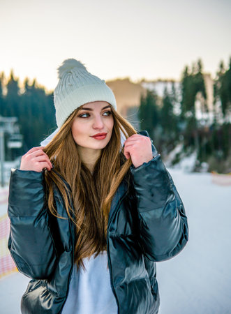 Portrait of Beautiful Cheerful Caucasian Girl On Ski Resort at Winterの写真素材