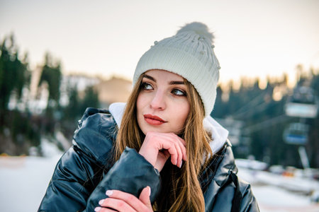 Portrait of Beautiful Cheerful Caucasian Girl On Ski Resort at Winterの写真素材