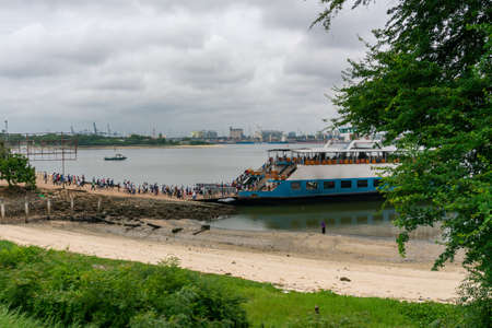DAR ES SALAAM, TANZANIA - JANUARY 2020: Crowd of African Black People Are Boarding on the Ferry in...