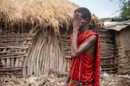 TANZANIA, MASAI VILLAGE - JANUARY 2020: Portrait of Maasai man people in native masai village Engare Sero on the coast of Natron Lake in Maasailand, Arusha districtのeditorial素材