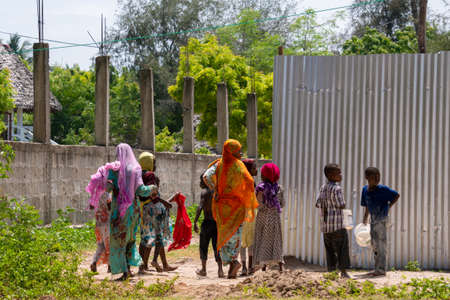 NUNGWI, TANZANIA - January 2020: Nungwi village, Black African Kids on the street of Fisherman Village, Zanzibar, Tanzaniaのeditorial素材