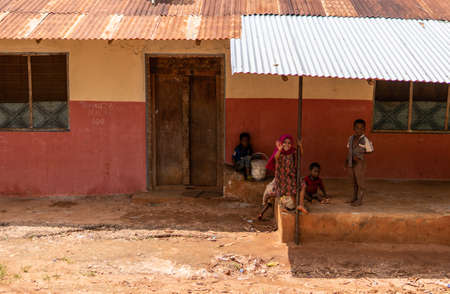 Zanzibar, Tanzania - JANUARY 2020: Group of Black African People in their Usual Lifestyle on Streets of Zanzibar Villageのeditorial素材