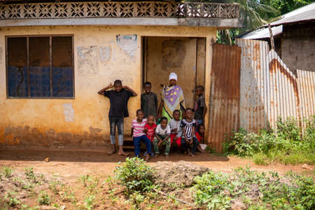 Zanzibar, Tanzania - JANUARY 2020: Group of Black African People in their Usual Lifestyle on Streets of Zanzibar Villageのeditorial素材
