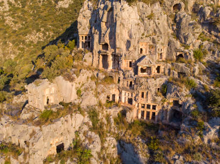 Aerial Shot Archeological remains of the Lycian rock cut tombs in Myra, Turkeyの写真素材
