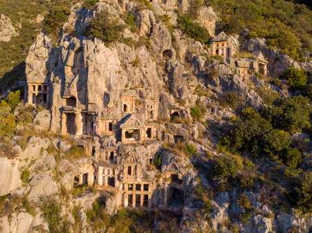 Aerial Shot Archeological remains of the Lycian rock cut tombs in Myra, Turkeyの写真素材