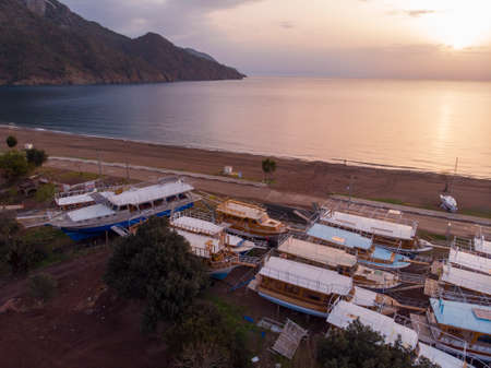 Aerial Shots of Adrasan. Boats are waiting for the High Season While Standing on the Ground Seaside view from Adrasan Beach along the Mediterranean coast in Kemer, Antalya Province, Turkeyの写真素材