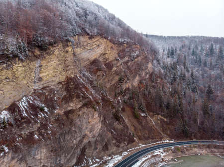 Wonderful landscapes of the Carpathian Mountains covered with snow at Cloudy Day in Ukraine near the village of Vyzhnytsia and River Cheremoshの写真素材