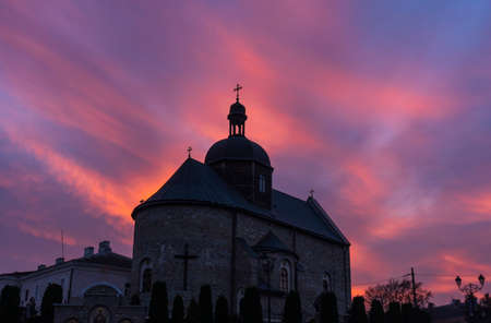 Orthodox Church in Kamyanets-Podilsky in Ukraine at SUnset Sky Backgroundの写真素材