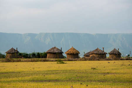 Masai village near Ngorongoro crater and Mto Wa Mbu. Small Masai huts in African savanna, Tanzaniaの写真素材