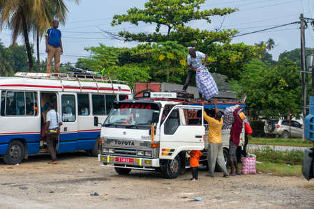 PEMBA, TANZANIA - JANUARY 2020: People are loading in the car on bus station in Tanzania, Pemba island, Zanzibar Archipelago. Eastern Africaのeditorial素材