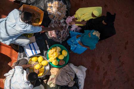 ZANZIBAR, TANZANIA - 5 JANUARY 2020: Black African People on the Ferry from Stone Town to Pemba island. Unguja to Pemba, Selling fruits on a local transportのeditorial素材