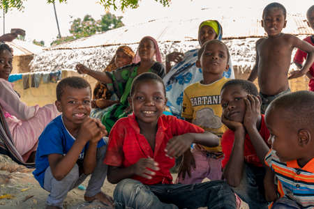 Pemba Island, Zanzibar, Tanzania - January 2020 : Young Cheerful African Kids in remote village Near their Basic Poor Homeのeditorial素材