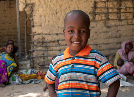 Pemba Island, Zanzibar, Tanzania - January 2020 : Young Cheerful African Kids in remote village Near their Basic Poor Homeのeditorial素材