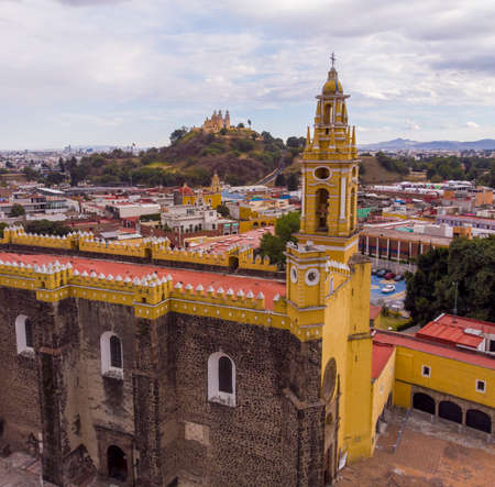 Aerial Drone Shot of San Gabriel Archangel Cathedral at cloudy day in Cholula, Puebla, Mexicoの写真素材