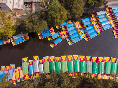 Aerial Drone Shot of Colorful Boats in Xochimilco. Tours by cannels with floating gardens in Mexico City CDMX, Mexicoの写真素材