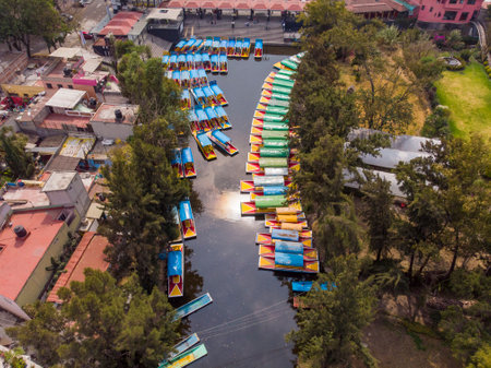 Aerial Drone Shot of Colorful Boats in Xochimilco. Tours by cannels with floating gardens in Mexico City CDMX, Mexicoの写真素材