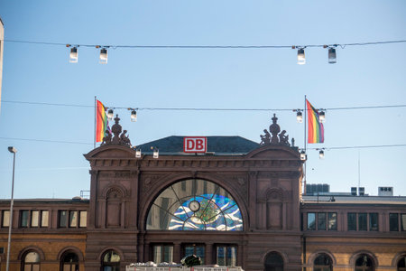 BONN, GERMANY - March 20, 2023: Logo of DB on the train station of Bonn Hauptbahnhof. With LGBT flags. Deutsche Bahnのeditorial素材