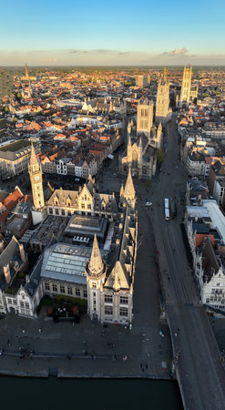 Ghent Belgium Aerial Flying over downtown area with church cityscape views at sunset time - October 2022の写真素材
