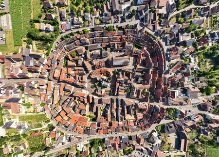 Top view on Eguisheim village in the Alsace province, France. Picturesque site at Evening time. Aerial Drone Shotの写真素材