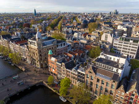 Historical Center of Amsterdam, Netherlands. Aerial Drone Shot of Traditional Dutch houses on narrow street and channel.の写真素材