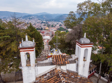 Aerial Drone shot of Church Iglesia de San Cristobalito on the mountain in San Cristobal de Las Casas, Chiapas, Mexicoの写真素材