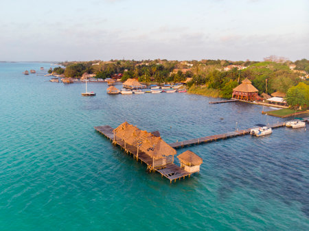 Aerial View at Bacalar city in Quintana Roo, Mexico at morning time. Docks on a pillars in a seven colors lagoonの写真素材