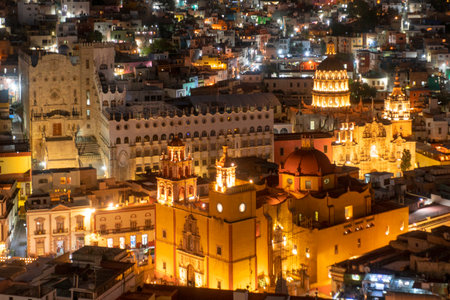 Guanajuato City, Mexico, aerial view of historical buildings in evening twilight. Close up of Templo de San Felipe Neriの写真素材