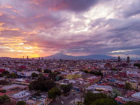 Puebla at Dramatic evening Sunset aerial drone shot of City Center in Puebla de Zaragoza, Puebla...