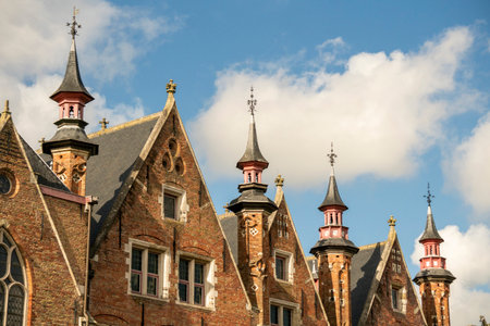 The City of Bruges in Dutch Brugge is the Beautiful Medieval Historical City. Architecture details in a sunny dayの写真素材