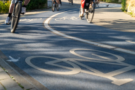 Close Up of a Bicycle Road. Blue Bike Lane With the Bicycles passing on the white symbol of a bike in Konstanz, Germany.の写真素材