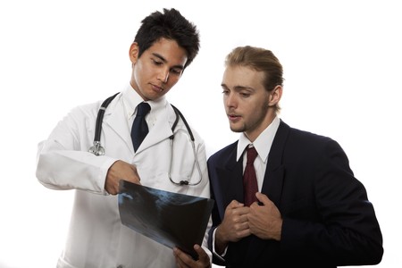 young asian doctor talking to his patient about an x-rayの写真素材
