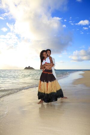 mixed race couple at the beach in hawaii の写真素材